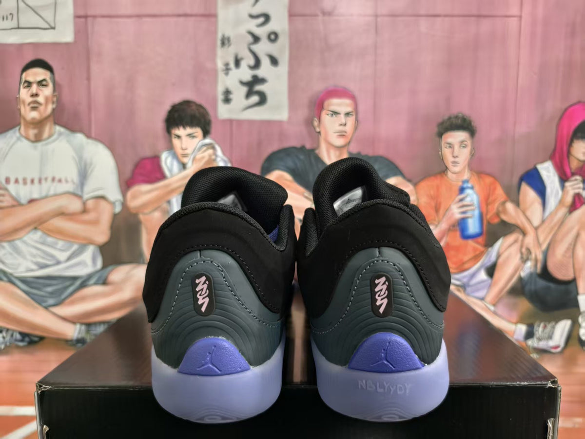 Rear view of black Jordan basketball sneakers with purple heel accents and translucent purple soles.