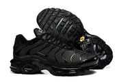 Nike Air Max Plus sneaker in an all-black appearance, with the outsole visible.