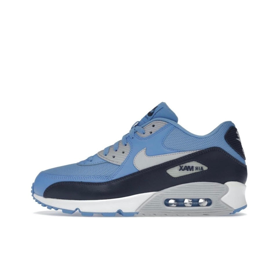 Side view of light blue, navy and white Nike Air Max sneakers with a visible heel Air unit