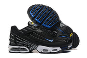 Side and outsole views of black Nike Air Max Plus TN sneakers with blue accents.