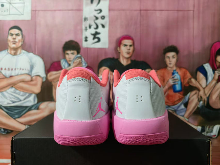 Rear view of white and pink Jordan basketball sneakers showing pink heel sections, collars, and Jumpman logos.