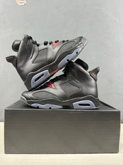 Angled view of two black sneakers highlighting the high collars, perforated panels, and red accents.