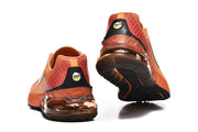 Rear and outsole views of orange sneakers with visible heel air units.