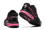 Heel and outsole views of black and pink Nike Air Max BW sneakers