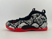 Black and white patterned high-top sneaker with a red outsole.