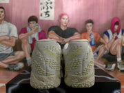 Rear view showing the textured heel panels, tonal branding details, and patterned outsole.