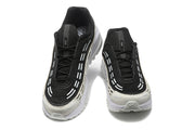 Front view of the pair showing black laces and contrasting uppers