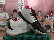 Angled view of the mismatched sneakers showing Nike side branding, black and white uppers, red lining, laces, and translucent-looking soles.