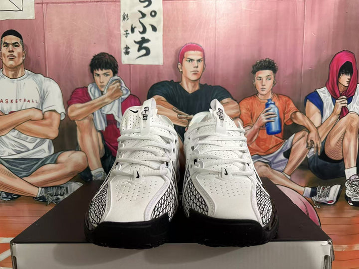 Front view of white and black Nike basketball shoes on a box