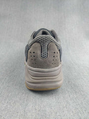Rear view showing the padded heel, perforated heel panel, and stacked sole design.