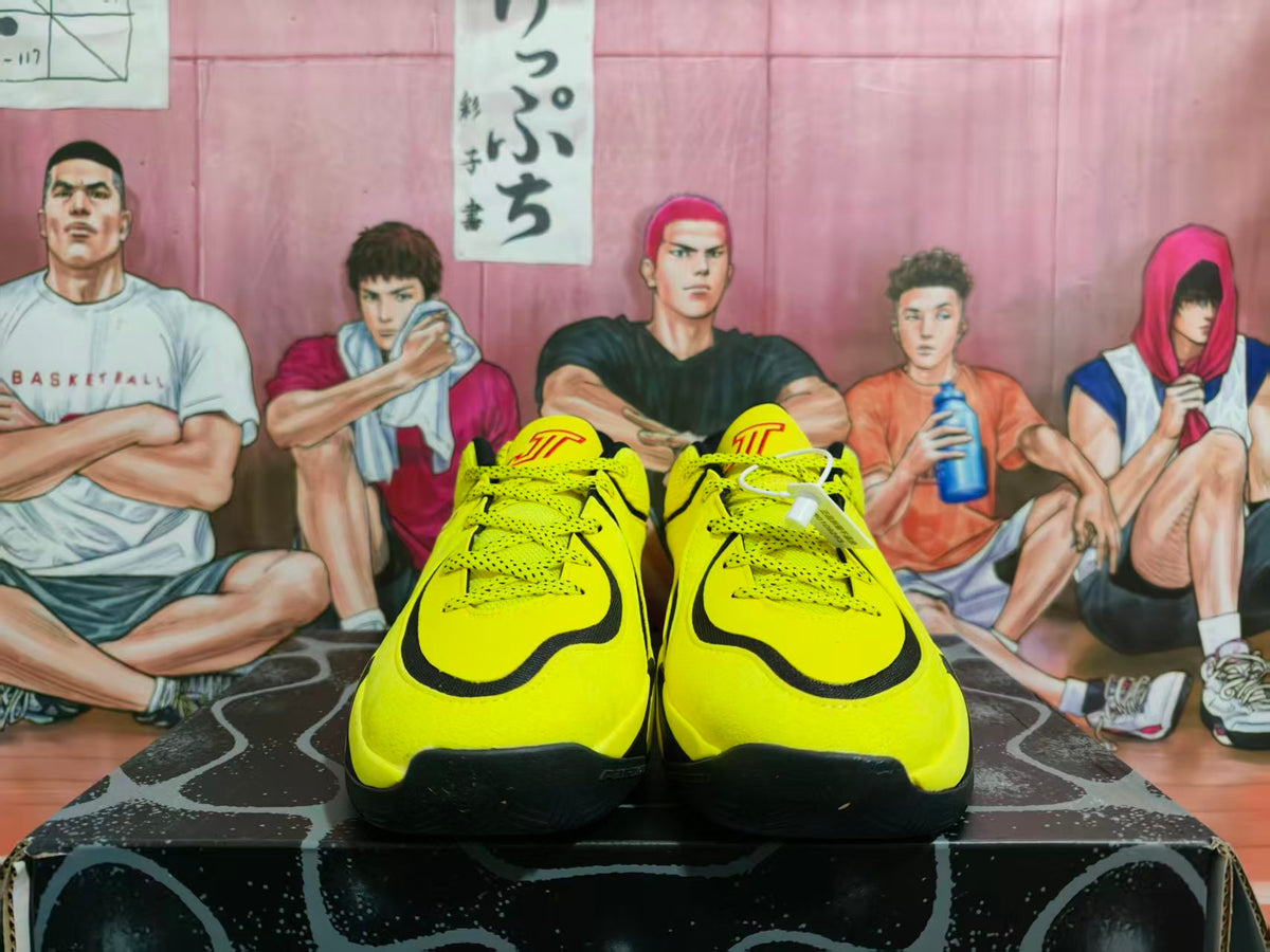 Front view of yellow and black Jordan basketball sneakers with laces and black trim.