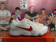 Side profile of a white Nike sneaker with a red Swoosh, white ribbed midsole, and red outsole.