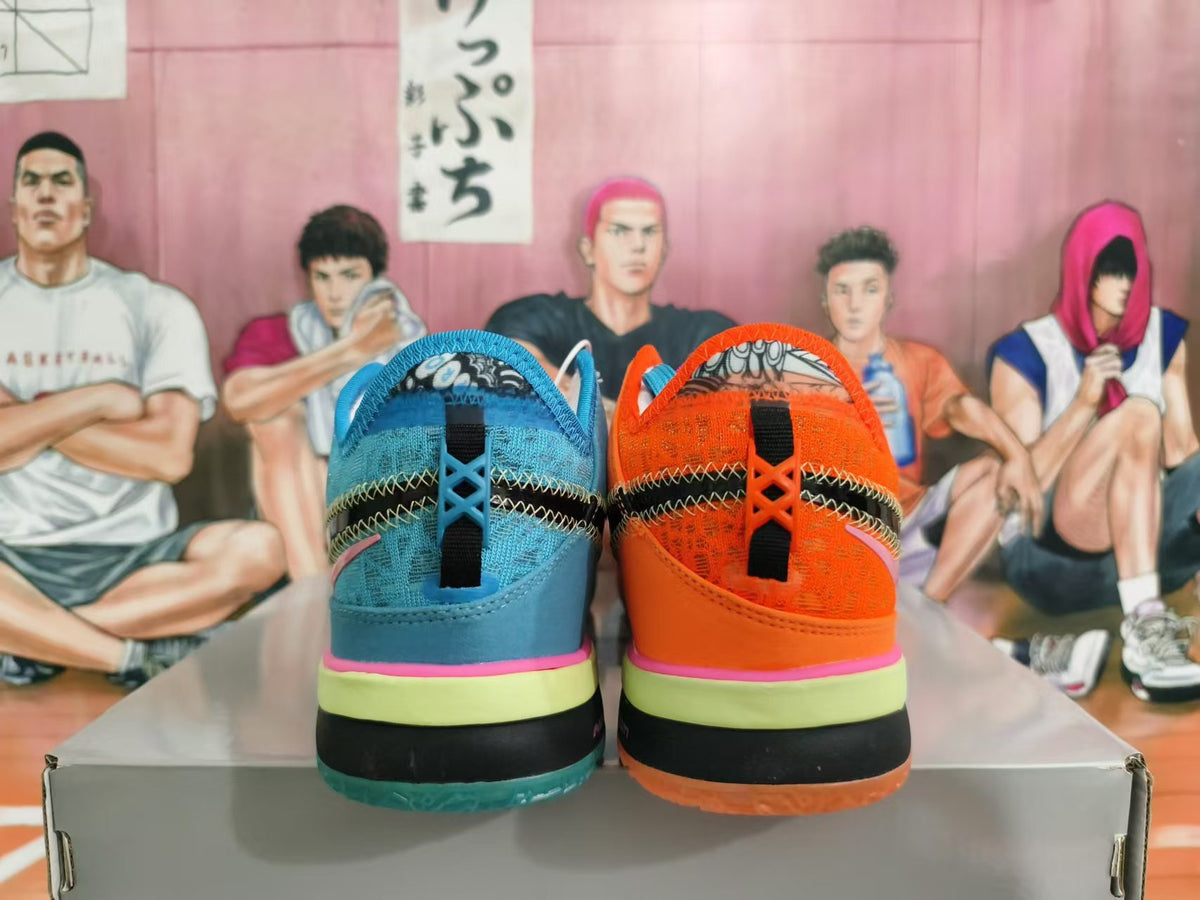 Rear view of mismatched orange and blue basketball shoes with contrasting layered soles.