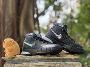 Pair of black high-top shoes with blue, purple, and multicolor accents.
