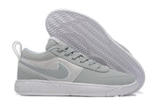 Gray and white low-top Nike Book 1 shoe with speckled sole