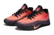 Pair of coral and dark purple Nike S.T. Flare EP basketball shoes shown from a front three-quarter angle.