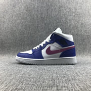 Full side profile of a blue, white, and pink Jordan Air 1 Mid sneaker