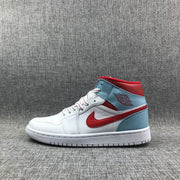 Full side profile of a white, ice blue, and red Jordan mid-top sneaker.