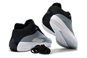 Blue-gray Jordan 40 sneaker shown from the heel and outsole.