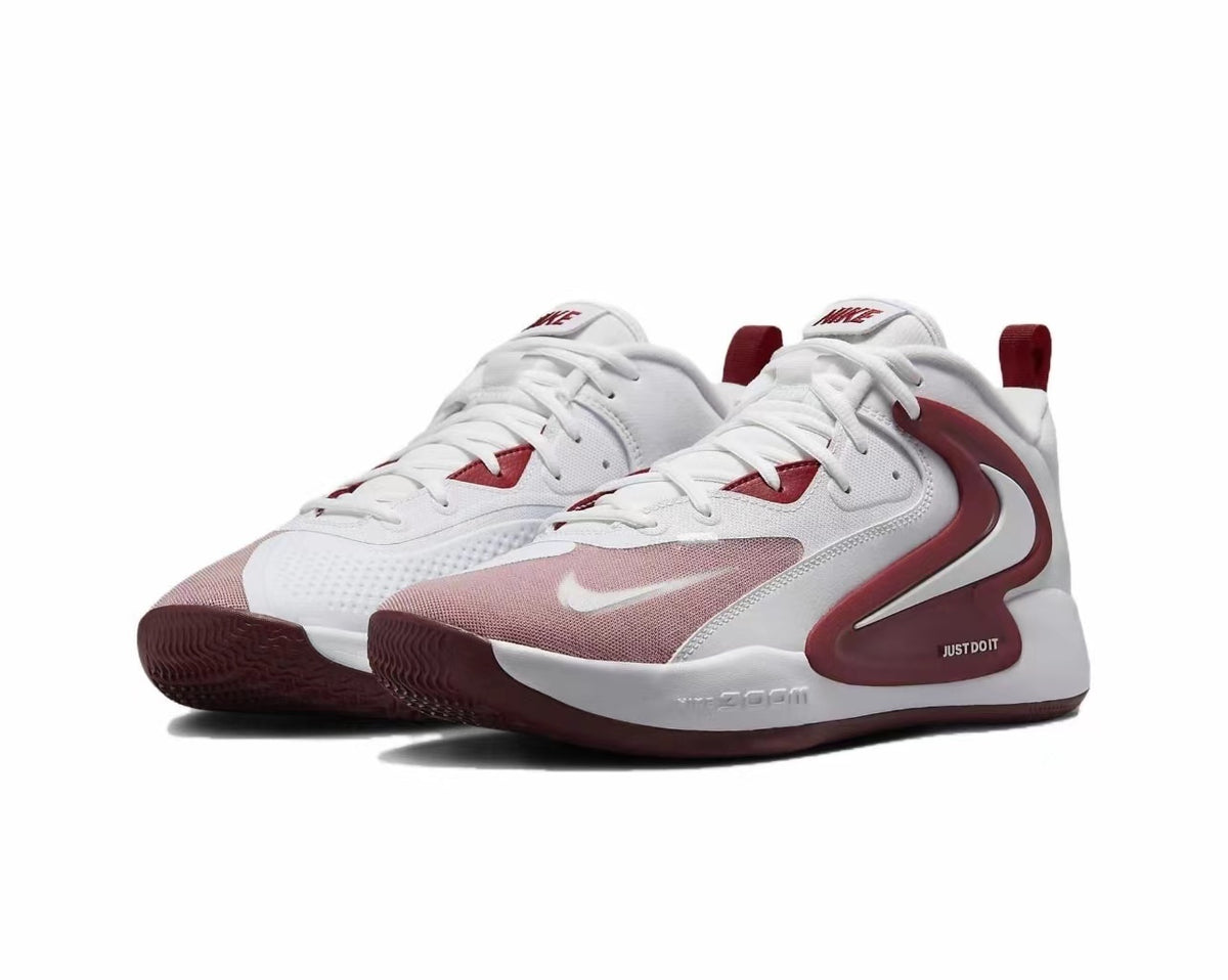 Pair of white and red Nike low-top sneakers shown on a white background, with lace-up fronts, red side accents, and heel pull tabs.
