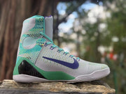 Opposite side view showing the patterned turquoise panels and purple Swoosh