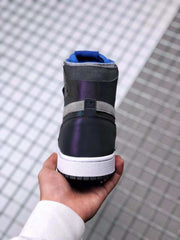 Rear view of the high-top sneaker showing the black and gray ankle area, blue collar lining, white midsole and black outsole.