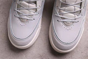 Close-up of the perforated toe boxes, laces, and layered front panels.
