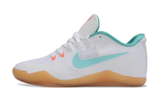 Side profile of the white and teal Kobe 11 shoe