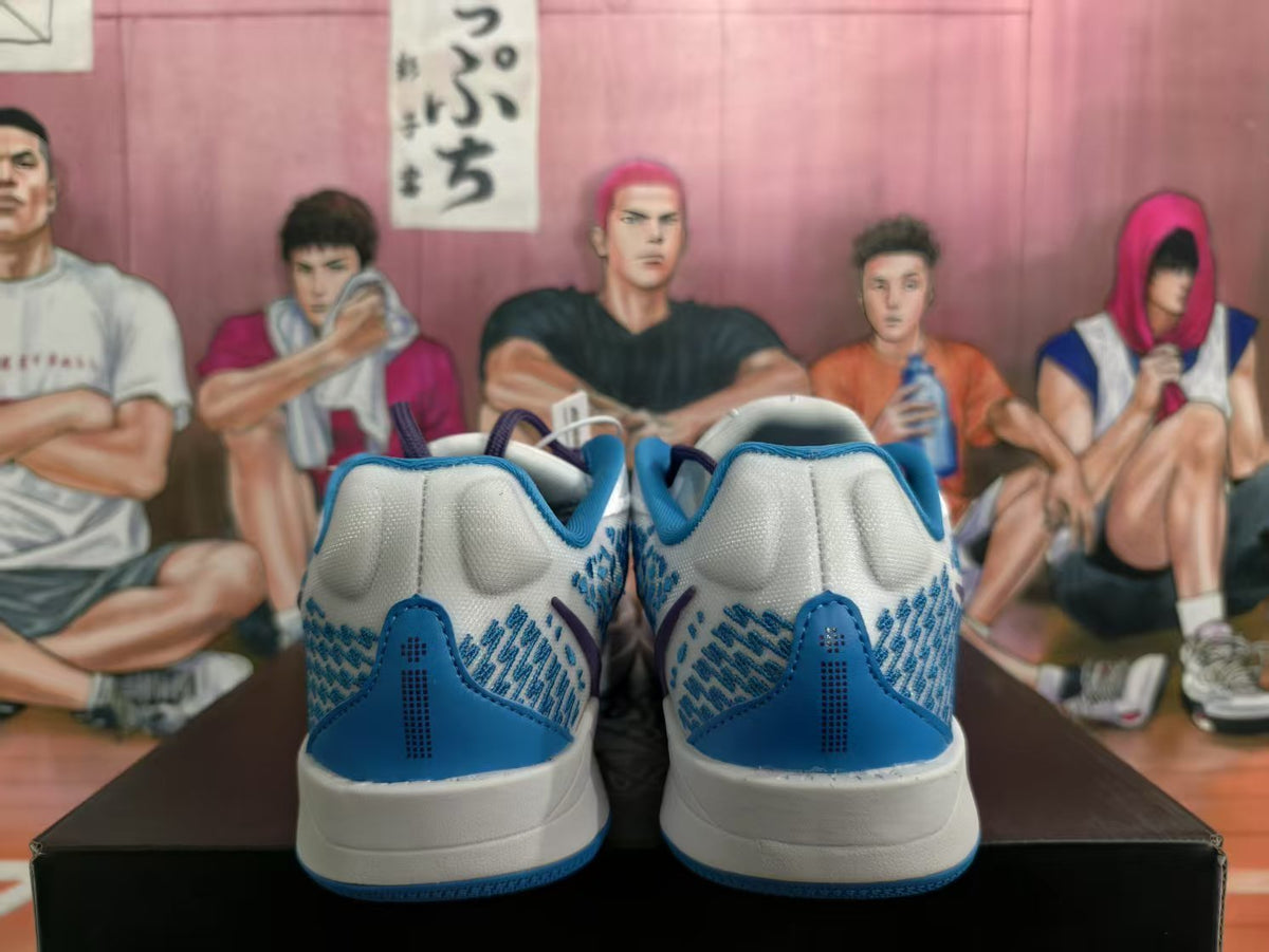 Rear view of blue and white Nike sneakers showing blue heel panels, textured side detailing and white midsoles.