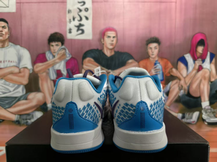 Rear view of blue and white Nike sneakers showing blue heel panels, textured side detailing and white midsoles.