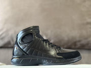 Side view of a black high-top Nike Air Zoom Huarache 2K4 basketball shoe.