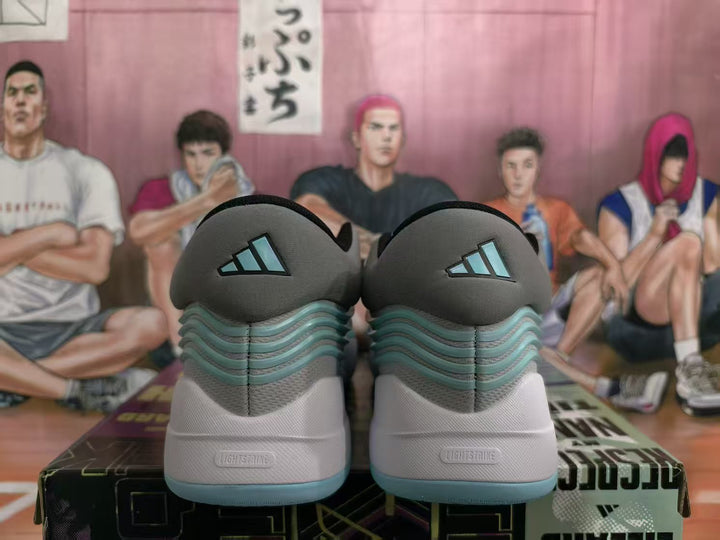 Rear view of blue-gray Adidas basketball sneakers showing aqua layered detailing, heel branding, and pale aqua outsoles.