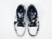 Top view showing the perforated white toe boxes, navy lining and Jordan tongue branding.