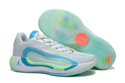 White, blue, and green Jordan Luka 4 basketball sneakers shown with one shoe displaying the translucent outsole.
