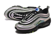 Angled top and side view of silver and black Nike Air Max 97 sneakers with green accents.