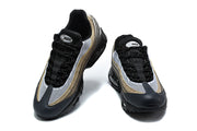 Front views of Nike Air Max 95 TT sneakers with white mesh, black laces and patterned side panels.