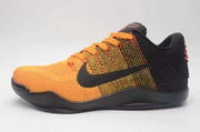 Side profile of an orange and black Nike Kobe 11 shoe