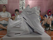 Pair of white high-top Jordan sneakers shown from a three-quarter side angle, highlighting the layered upper, molded side supports, and midsole air-window detail.