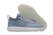 Blue-gray low-top Nike Book 1 shoe with pale sole