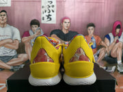 Rear view of the yellow shoes with floral-print heel panels