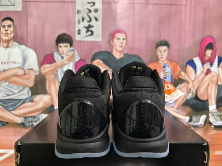 Rear view of black and dark purple Nike basketball sneakers on a black shoebox, with a basketball-themed illustrated backdrop.