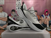 Angled view of Wade basketball shoes showing patterned laces and sculpted soles