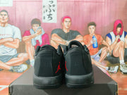 Rear view showing the black heels, red Jordan logos, padded collars, and textured outsole edges.