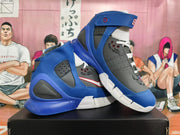 Angled view of a pair of blue and gray Nike Zoom Kobe 2K5 sneakers