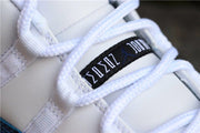 Close-up of white laces and the tongue label on the sneaker.