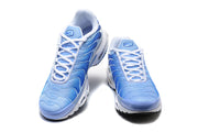 Front views of blue Nike Air Max Plus sneakers with white laces.