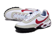 Angled top and side view of white and red Nike-branded lace-up sneakers.