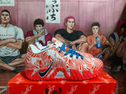 Side view showing the Nike Swoosh, patterned upper, blue laces, orange outsole, and visible ZoomX marking.