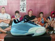 Side view of a blue Jordan basketball sneaker showing dark laces, a textured mesh panel, and a pale outsole.