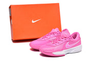 Pink Nike sneakers displayed beside an orange Nike shoebox.